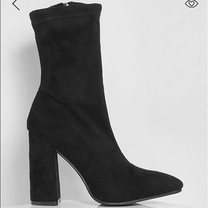 Black pointed toe sock boots